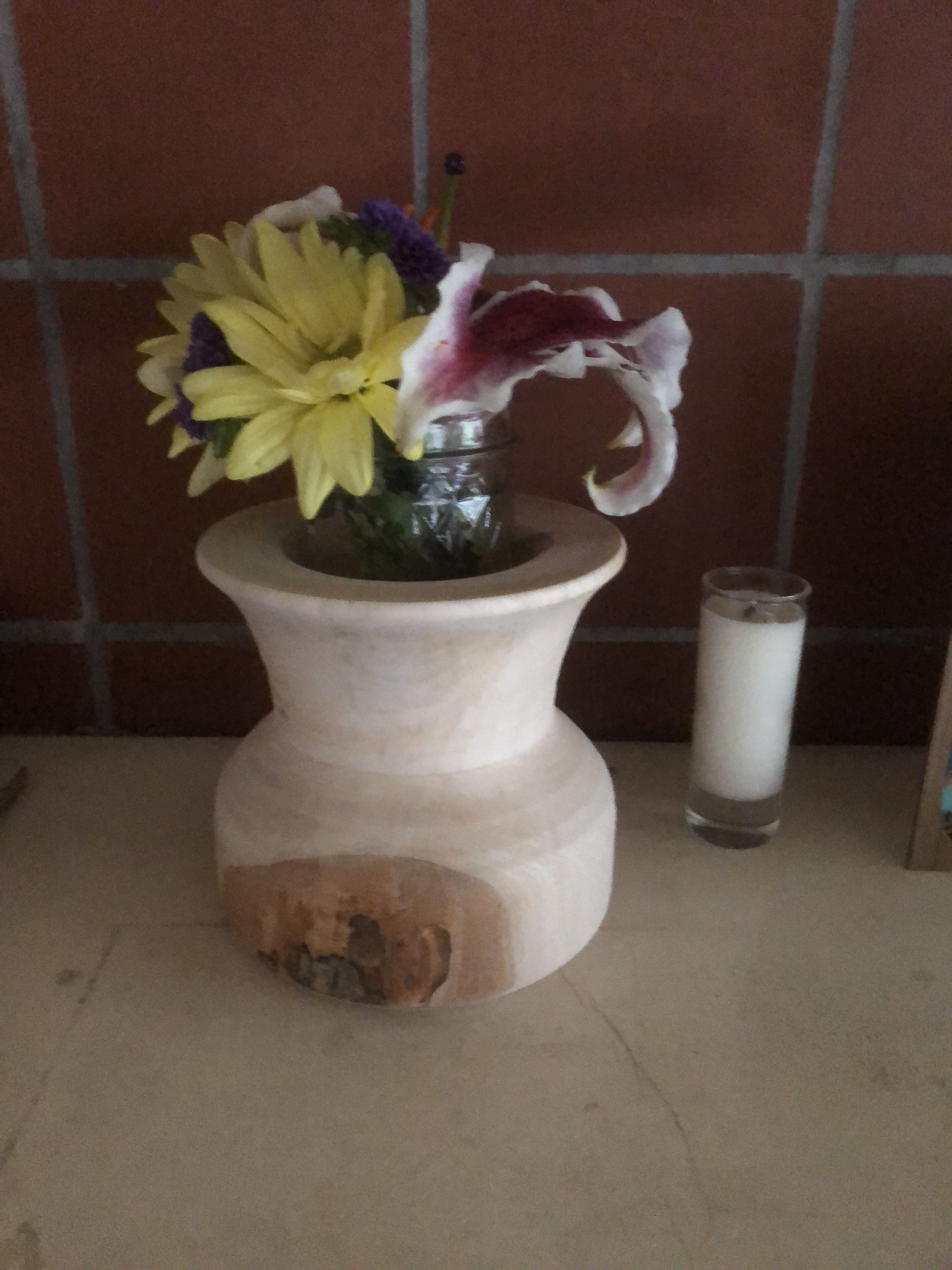 Flower vase with some live edge made of Maple.  Has a small jar to keep the flowers alive longer.